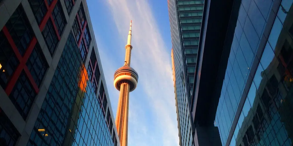 Toronto CN Tower between buildings