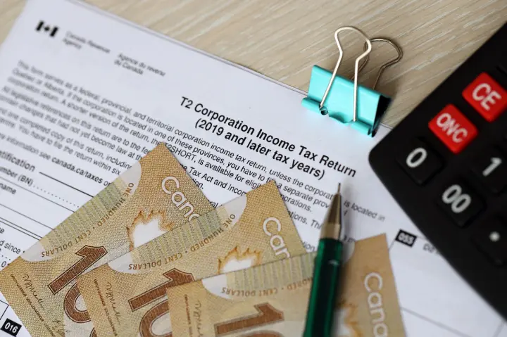 canadian-t-tax-form-corporation-income-tax-return-lies-table-with-canadian-money-bills-close-up