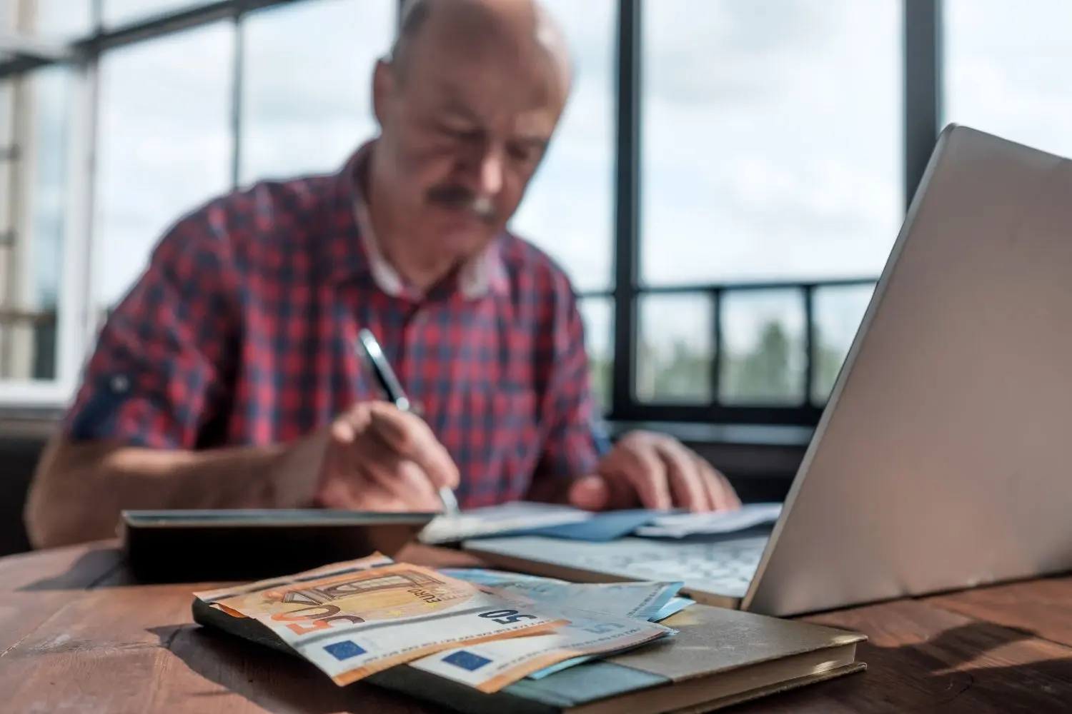 serious-mature-hispanic-man-man-checking-home-finance-calculating-money
