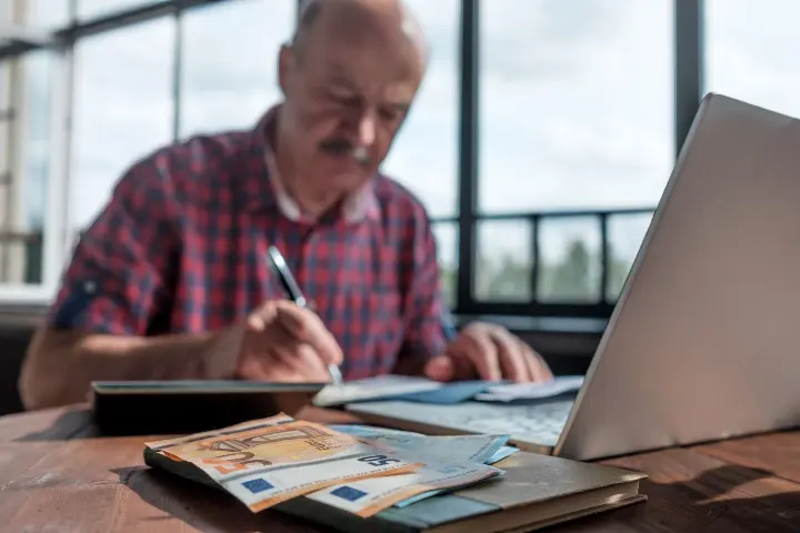 serious-mature-hispanic-man-man-checking-home-finance-calculating-money